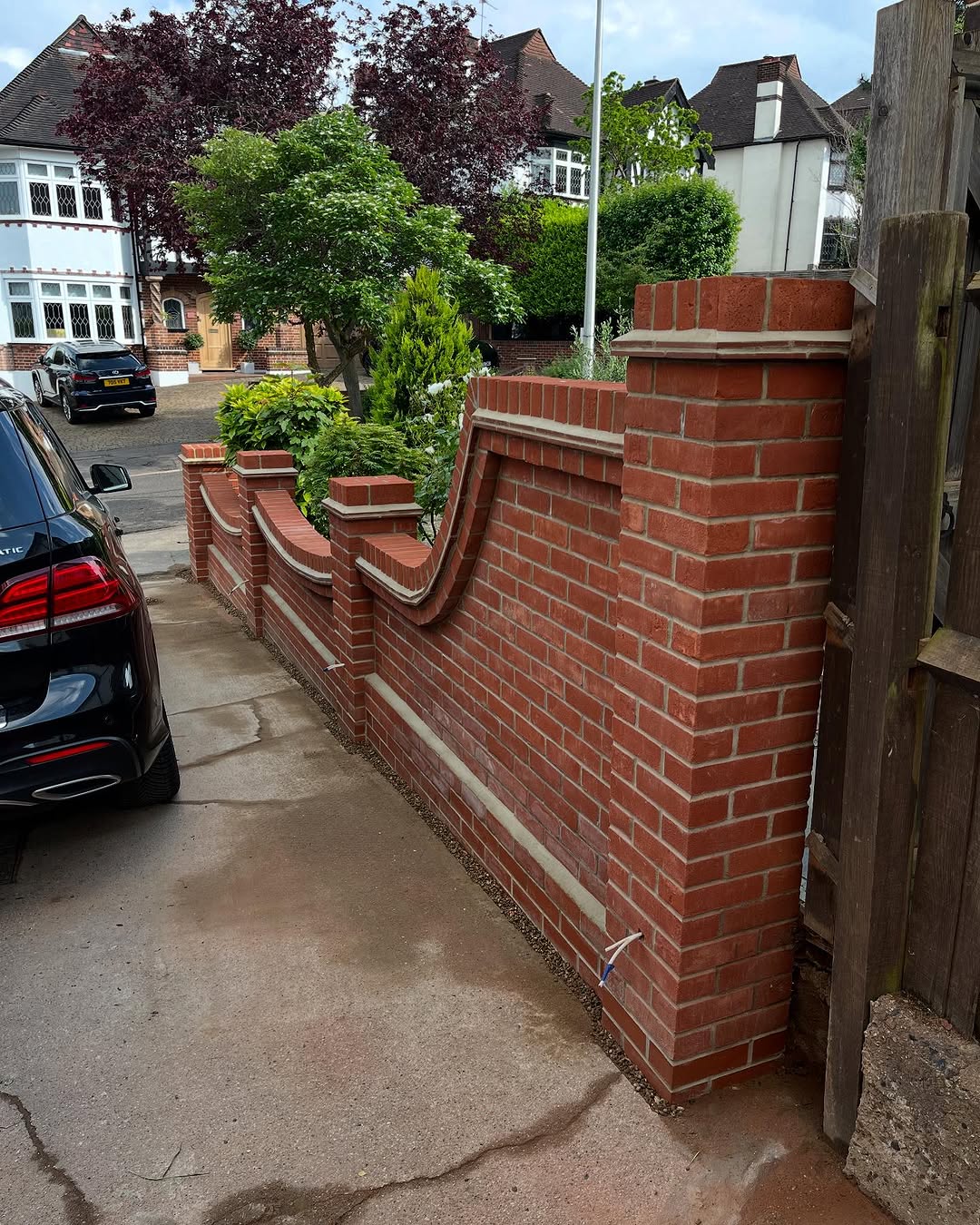 Custom brick exterior wall with elegant curved design